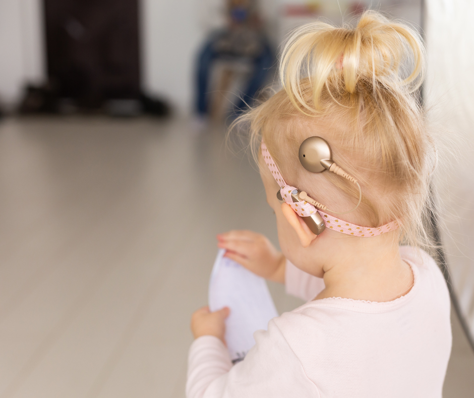 child with hearing aid